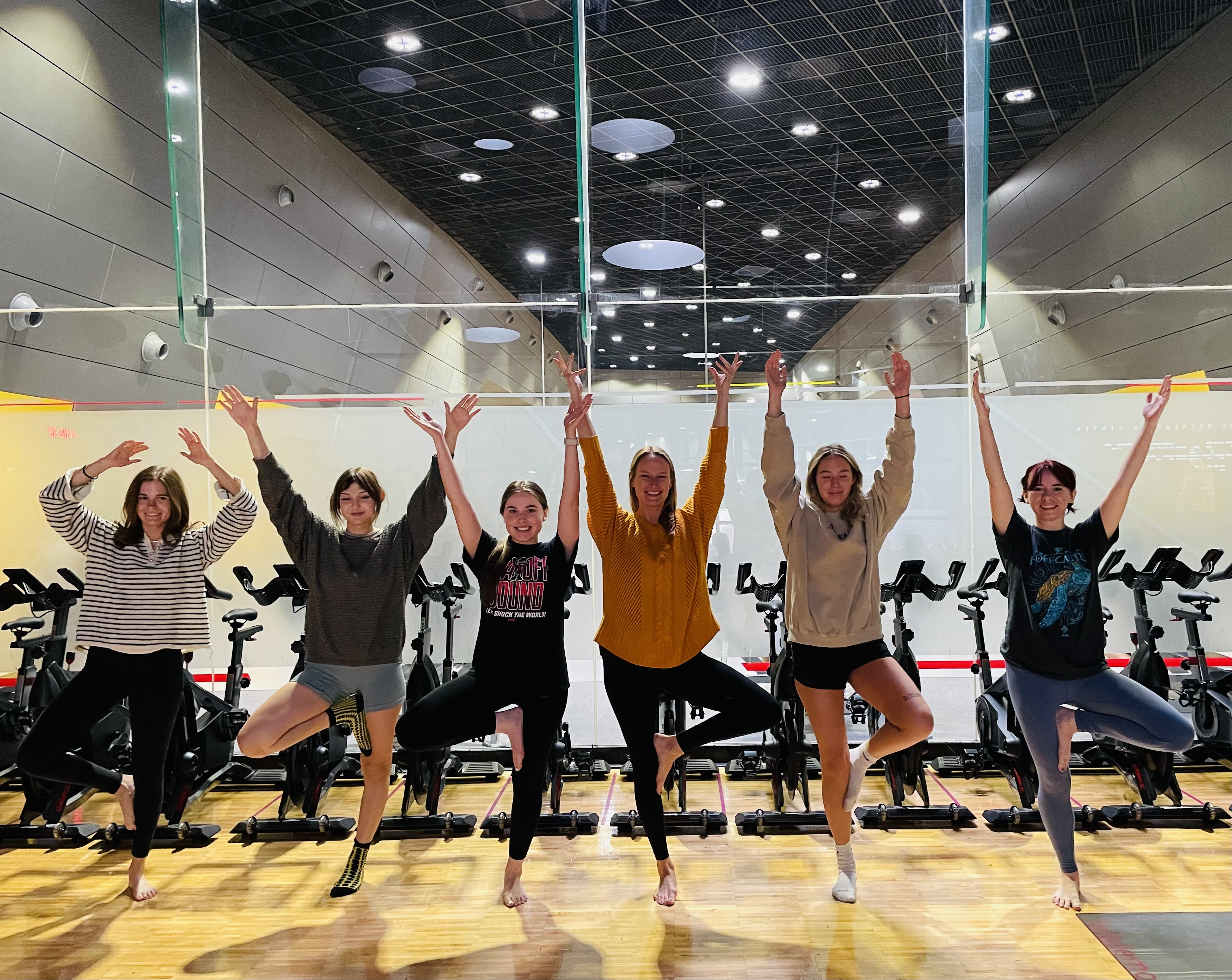 students doing a yoga pose
